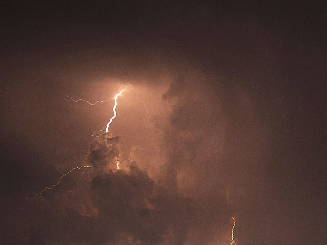 A towering cumulonimbus at first light