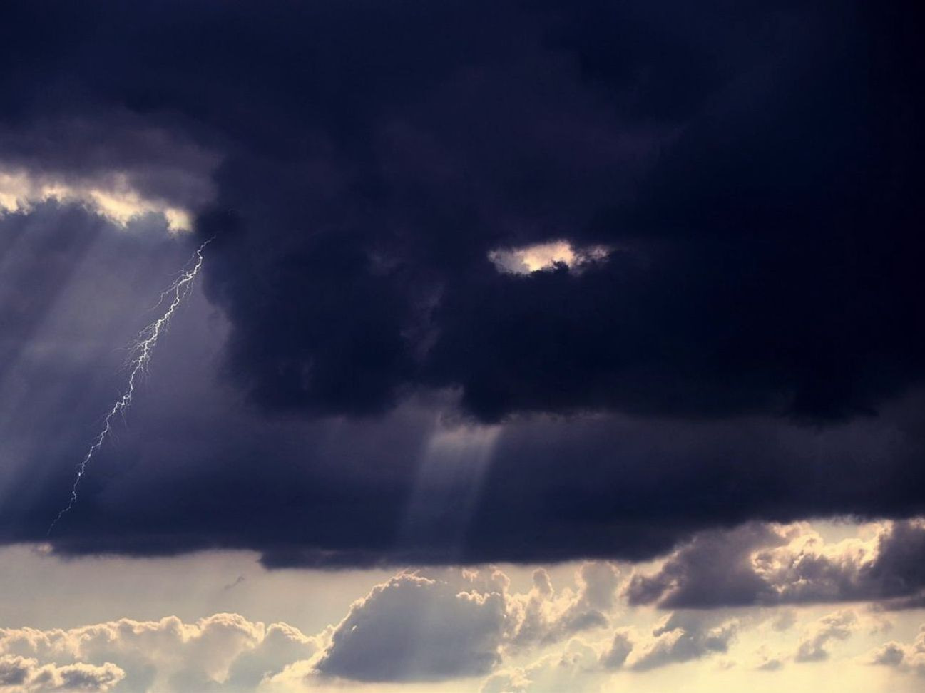 Dark clouds gathering above an empty horizon